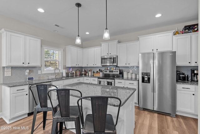 451 Gretchen Rd, West End, NC 27376 - kitchen with visible vents, white cabinetry, stainless steel appliances, and a sink