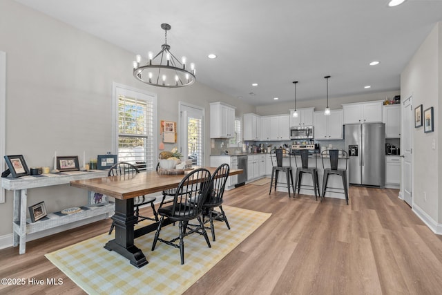 451 Gretchen Rd, West End, NC 27376 - dining room featuring recessed lighting, light wood-style flooring, baseboards, and a notable chandelier