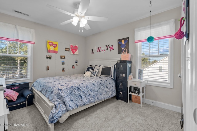 carpeted bedroom with ceiling fan