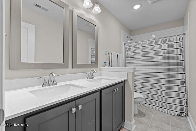 451 Gretchen Rd, West End, NC 27376 - bathroom featuring toilet, visible vents, a sink, and double vanity