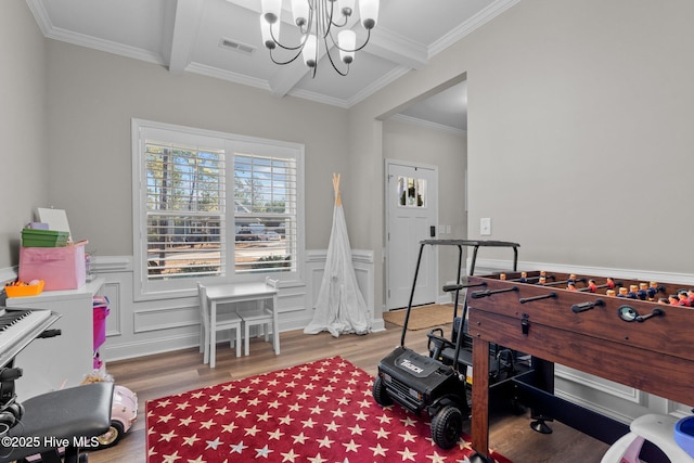 451 Gretchen Rd, West End, NC 27376 - rec room with an inviting chandelier, wood finished floors, visible vents, ornamental molding, and wainscoting
