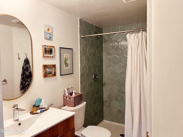 bathroom featuring toilet, vanity, and a shower with shower curtain