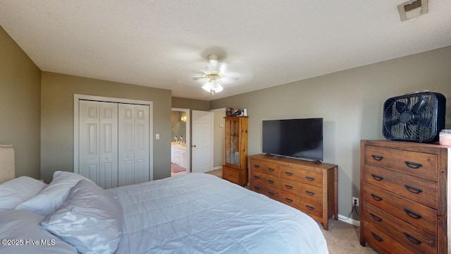 bedroom featuring a closet, ceiling fan, and carpet flooring