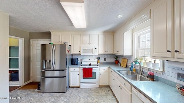 kitchen with sink, tasteful backsplash, a textured ceiling, white appliances, and white cabinets