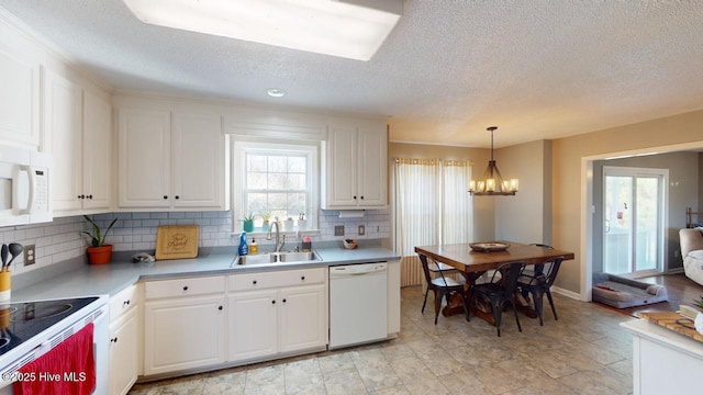 kitchen featuring white cabinetry, white appliances, and sink