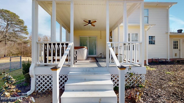 wooden terrace featuring ceiling fan