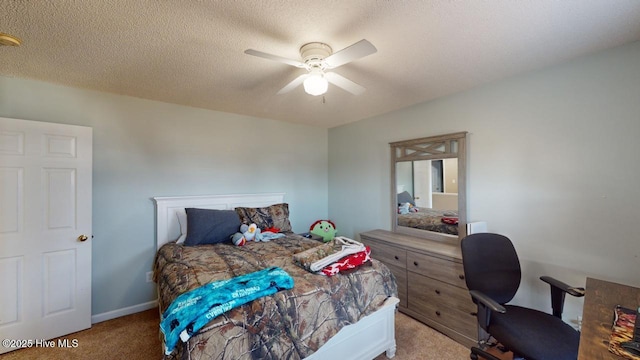 carpeted bedroom featuring ceiling fan and a textured ceiling