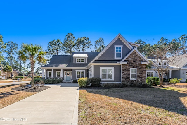 view of front of property with a porch and a front yard