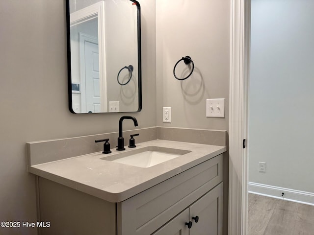 3387 Four Water Ln SW, Supply, NC 28462 - bathroom with vanity, wood finished floors, and baseboards