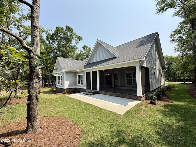 3387 Four Water Ln SW, Supply, NC 28462 - rear view of house featuring a shingled roof, a lawn, and a patio area