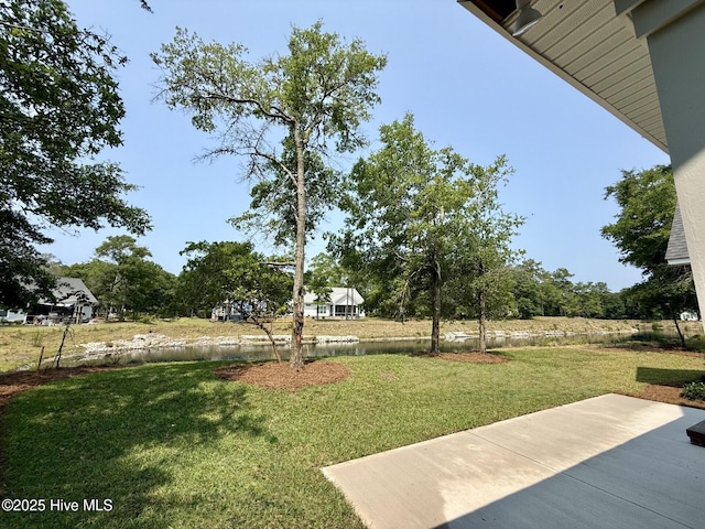 3387 Four Water Ln SW, Supply, NC 28462 - view of green lawn with a patio area