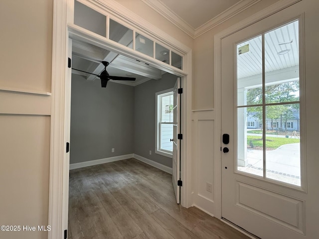 3387 Four Water Ln SW, Supply, NC 28462 - entrance foyer featuring wood finished floors, crown molding, baseboards, a ceiling fan, and beam ceiling