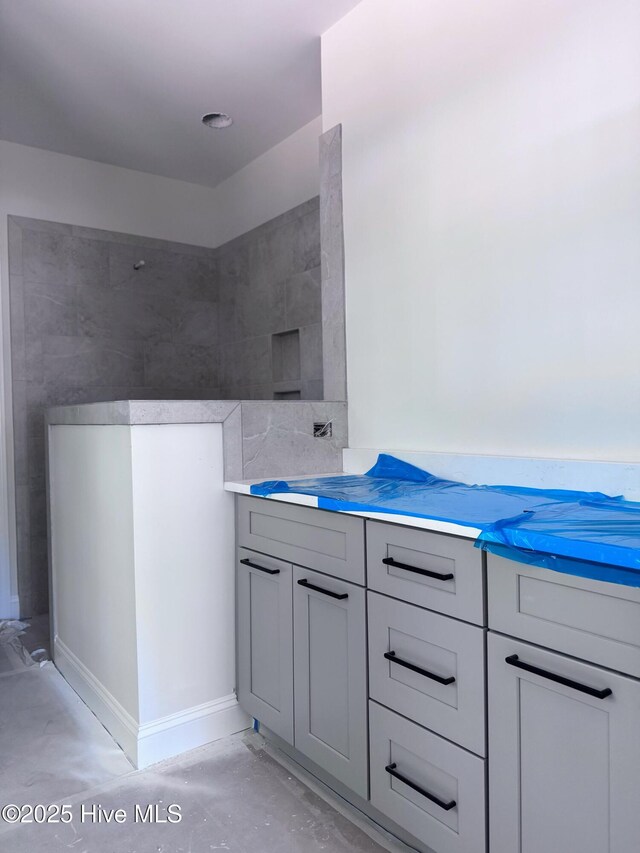 bathroom with concrete flooring