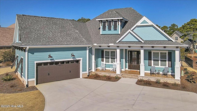 view of front of home featuring a garage and covered porch