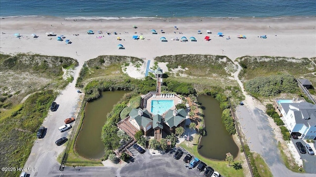 aerial view featuring a water view and a view of the beach