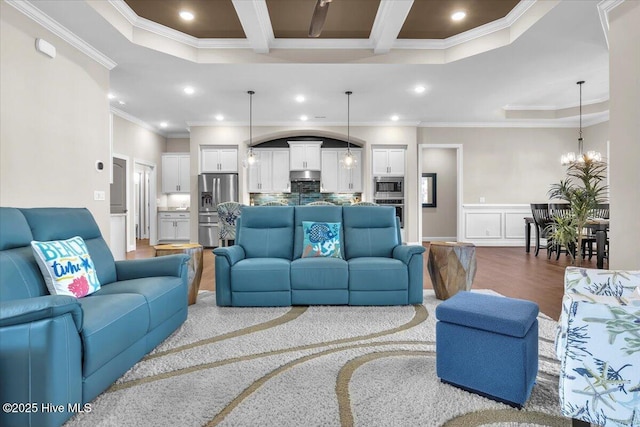 living room with crown molding, hardwood / wood-style flooring, beam ceiling, coffered ceiling, and a notable chandelier