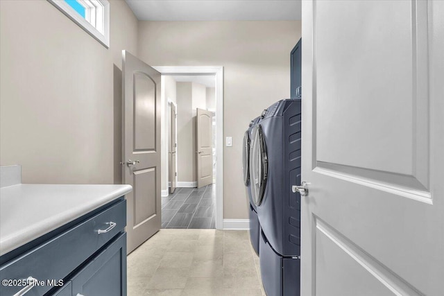 laundry room with cabinets and washing machine and dryer