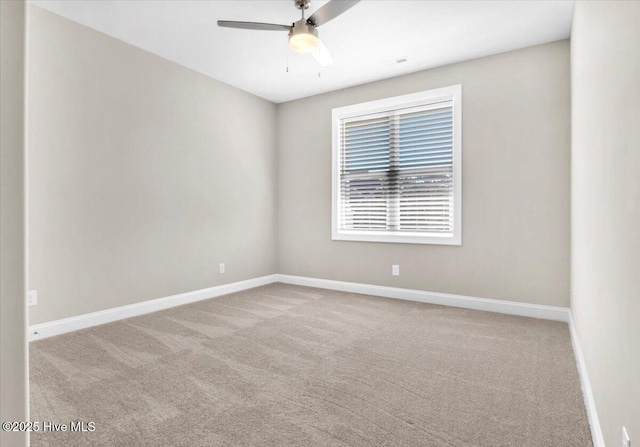 carpeted empty room with ceiling fan