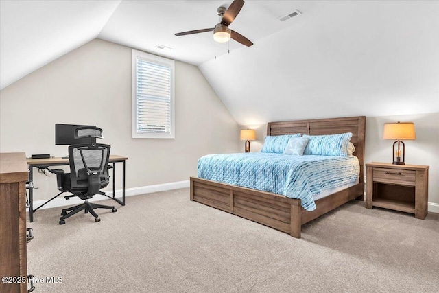 carpeted bedroom with vaulted ceiling and ceiling fan