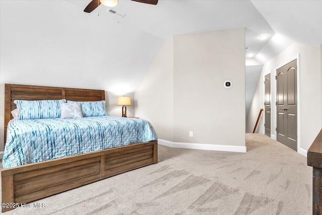 carpeted bedroom with ceiling fan and lofted ceiling