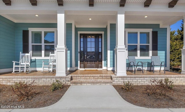 doorway to property featuring a porch