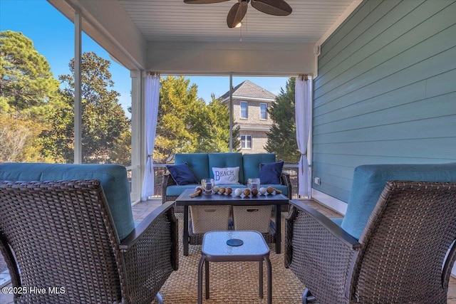 sunroom / solarium featuring ceiling fan