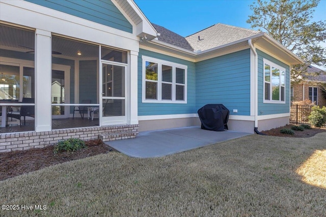 exterior space with a patio area and a lawn