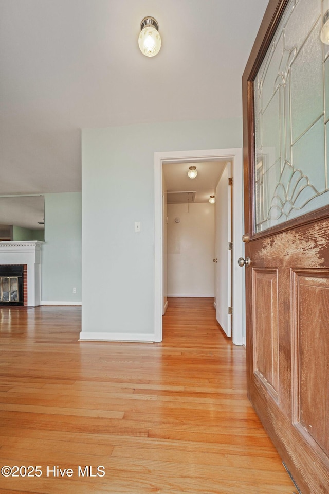 hall with light wood-type flooring