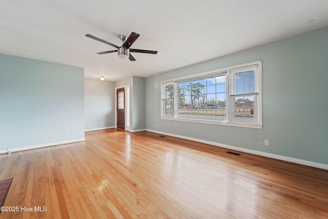 spare room with light hardwood / wood-style flooring and ceiling fan