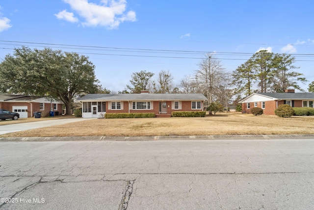 single story home featuring a front yard