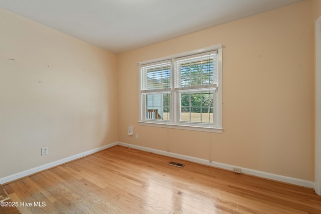 unfurnished room featuring light wood-type flooring