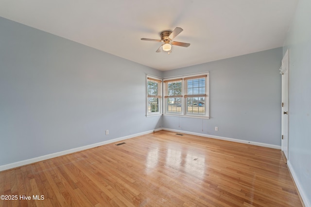 spare room with ceiling fan and light hardwood / wood-style flooring