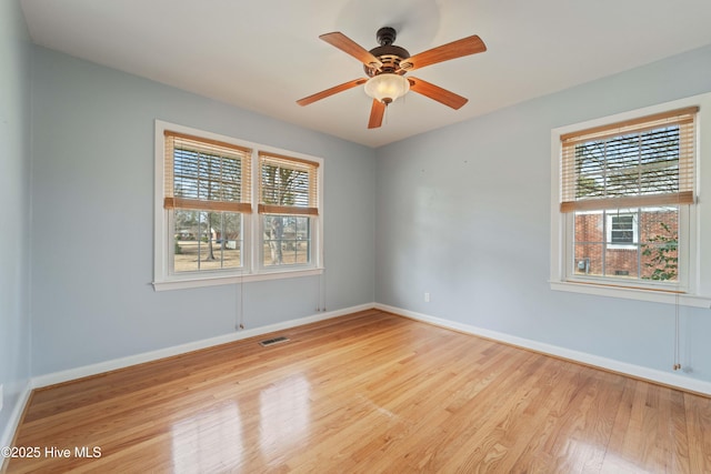 spare room featuring ceiling fan and light wood-type flooring