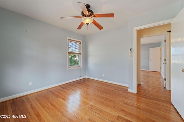 unfurnished room featuring ceiling fan and light wood-type flooring