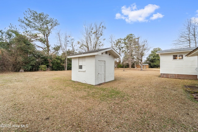 view of outdoor structure with a yard