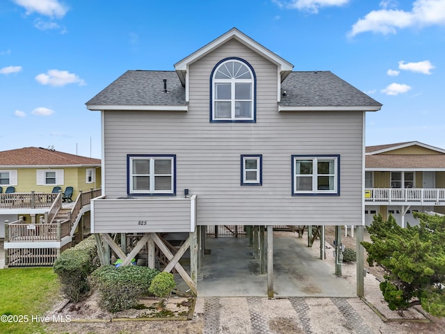 back of property with a carport