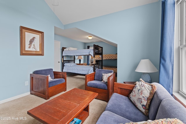 bedroom featuring lofted ceiling and light carpet