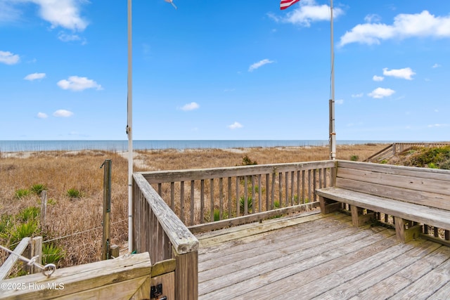 wooden deck with a water view