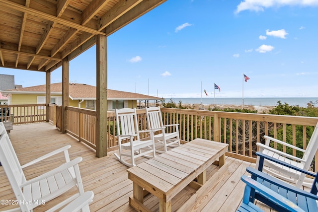 wooden terrace with a water view