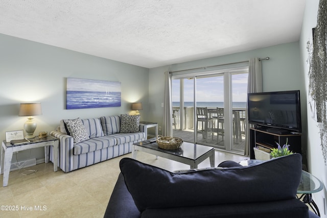 living room with a textured ceiling