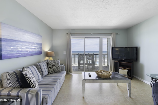 living room with a textured ceiling