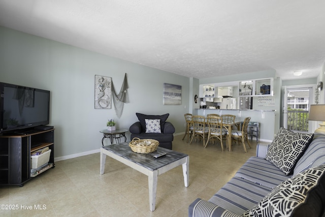 living room featuring a textured ceiling