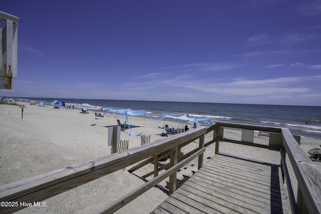 exterior space featuring a water view and a view of the beach