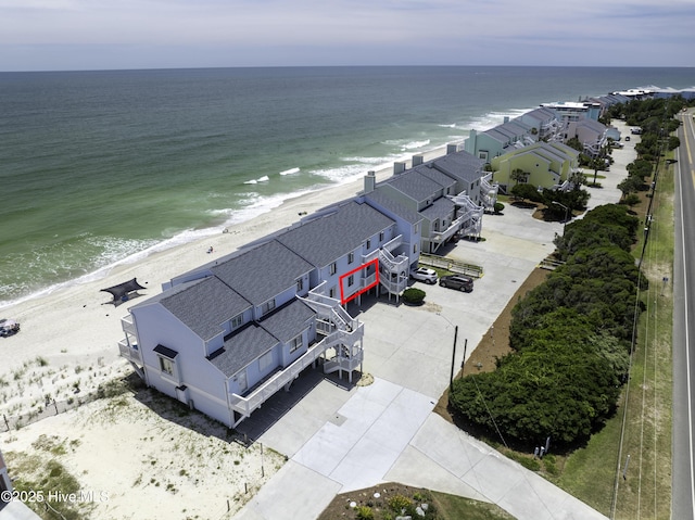 bird's eye view featuring a beach view and a water view