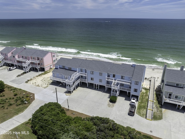 bird's eye view with a beach view and a water view