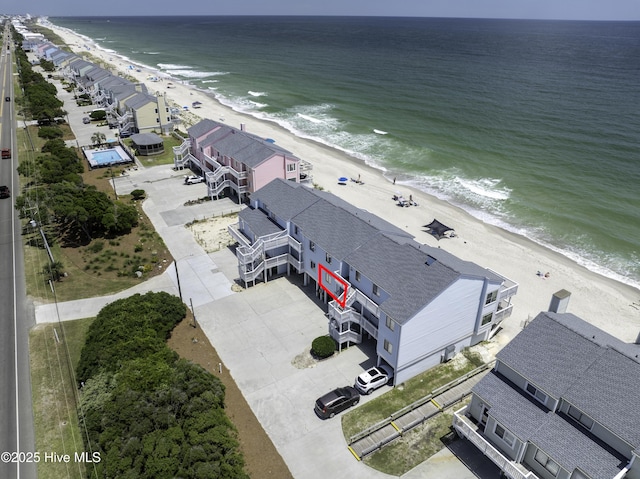 birds eye view of property featuring a view of the beach and a water view