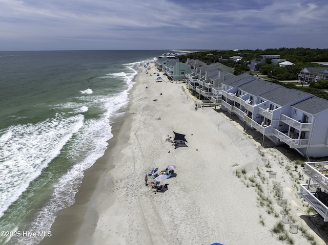 bird's eye view with a water view and a view of the beach