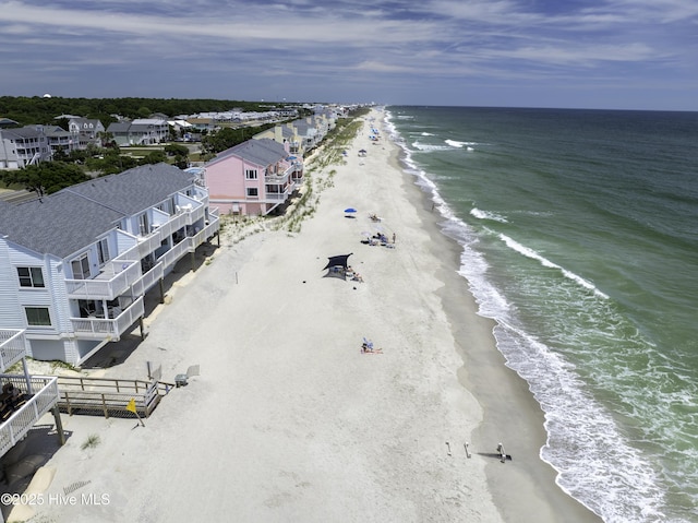 birds eye view of property featuring a view of the beach and a water view