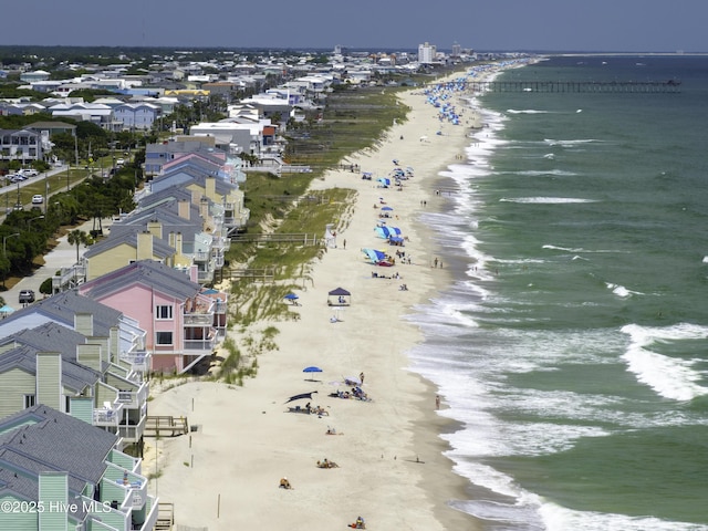 bird's eye view with a water view and a view of the beach