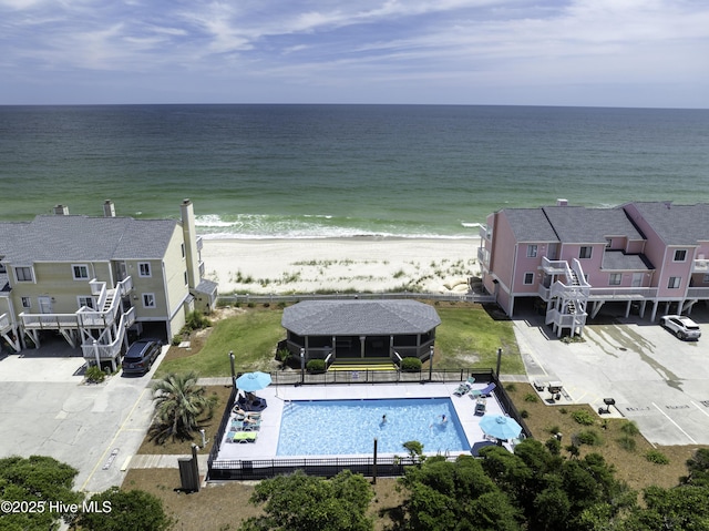 drone / aerial view with a water view and a view of the beach